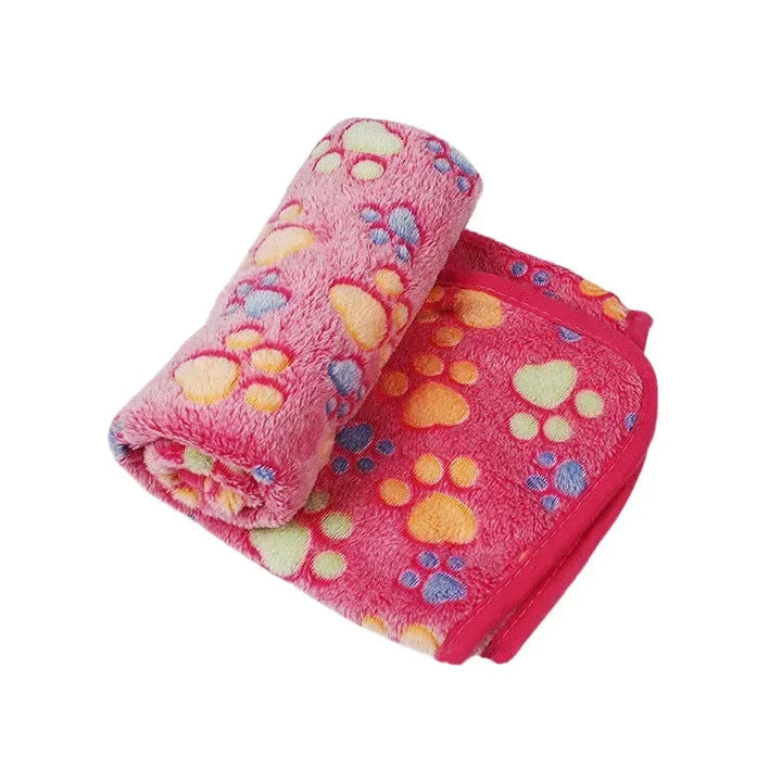 Soft coral fleece pet blanket, featuring a vibrant color to brighten any pet's sleeping area.