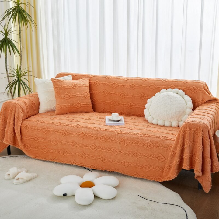 Close-up of fluffy faux fur sofa cover texture, highlighting its softness and cozy appeal for living spaces.