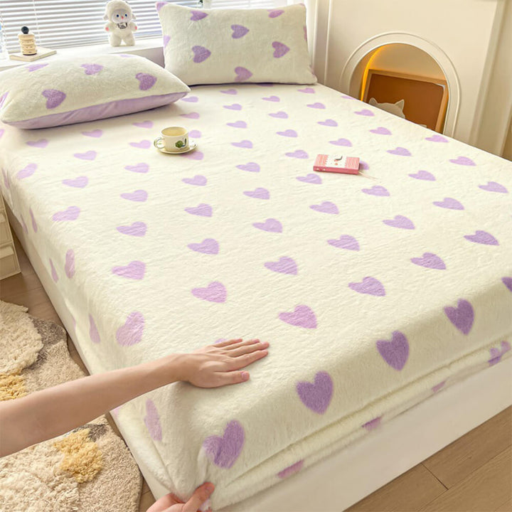 Home decor shot: fully made bed with a static-free velvet fitted sheet and pillowcase set