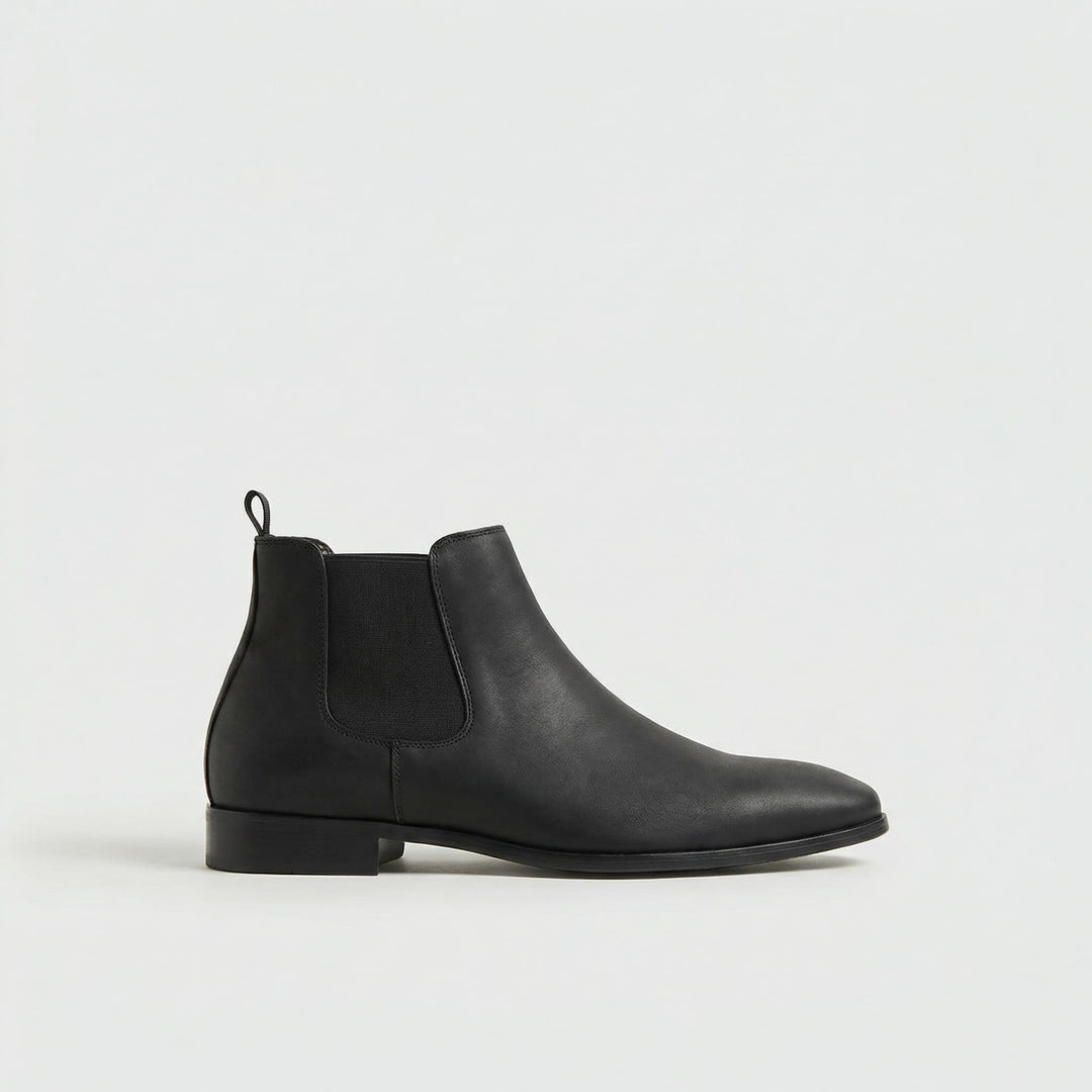 Men's Stratton black leather Chelsea boots, side view. Stylish, versatile ankle boots for everyday wear.