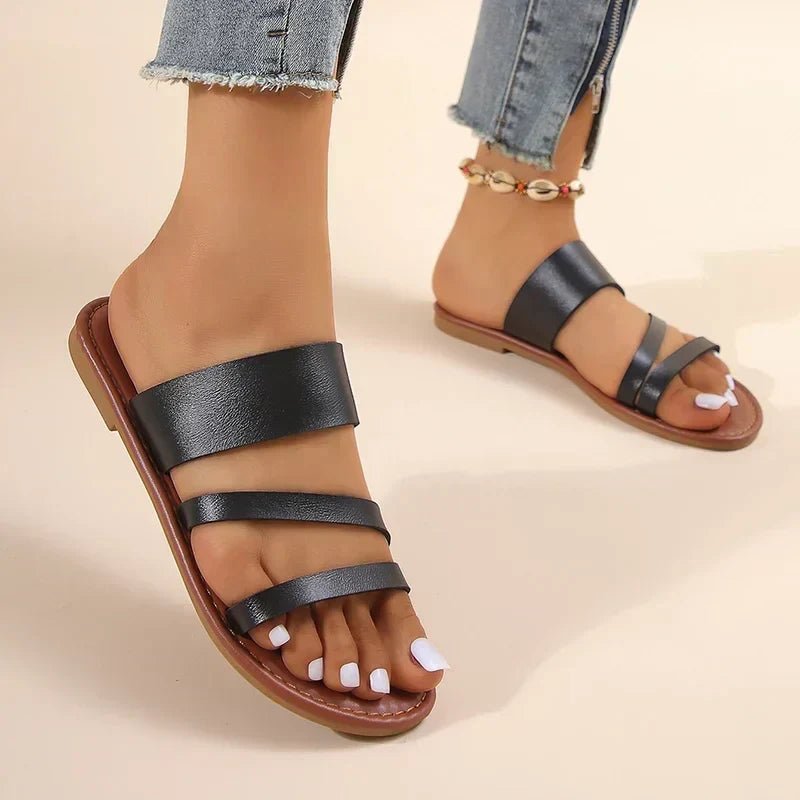 Women's open-toe flat sandals with comfortable cushioning, ideal slip-on cross-strap summer shoes.