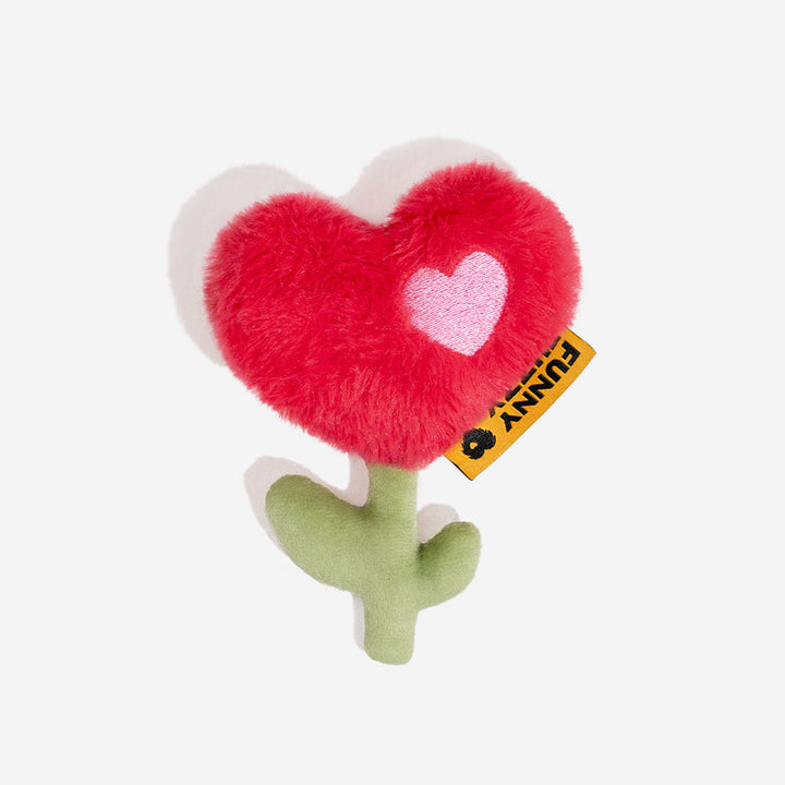 Close-up of a smiling plush pineapple squeaky dog toy, cute pet accessory.