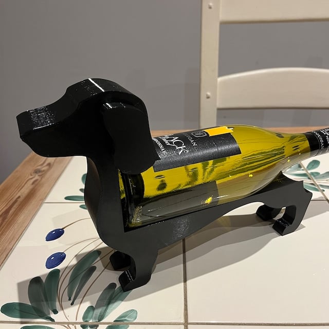 "Dackel Weinflaschenhalter: Stilvoller Dackelstil in verschiedenen Farben, elegant für Ihre Weinpräsentation"