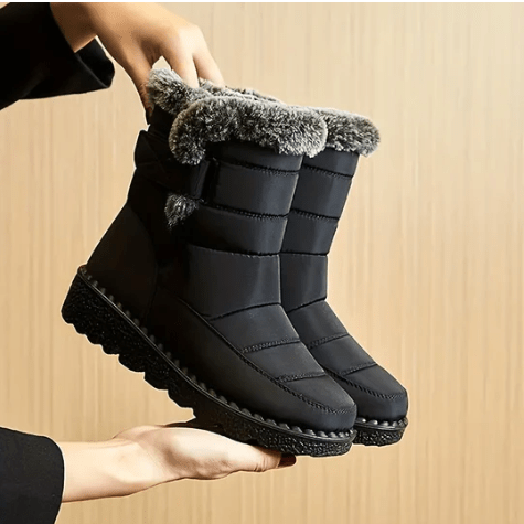 "Damen winterfeste Stiefel, wasserdicht, schwarz, mit rutschfester Sohle, für zuverlässigen Halt und elegantes Design."
