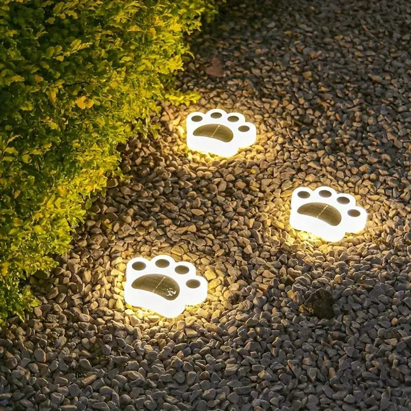 Wireless paw print solar outdoor lighting for a charmed garden, path, or patio accessory. 7-pack.
