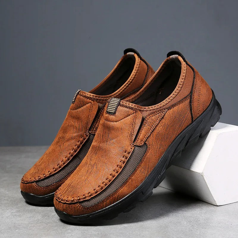 Dark brown men's slip-on loafers. Breathable, cushioned comfort shoes, perfect for casual everyday wear.