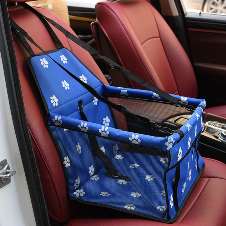 Small dog pet booster seat for car travel, designed with comfort and safety in mind.