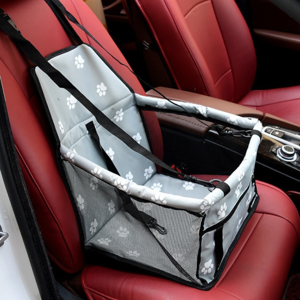 Pet travel gear: dog booster car seat for small dogs, secures to vehicle seats.