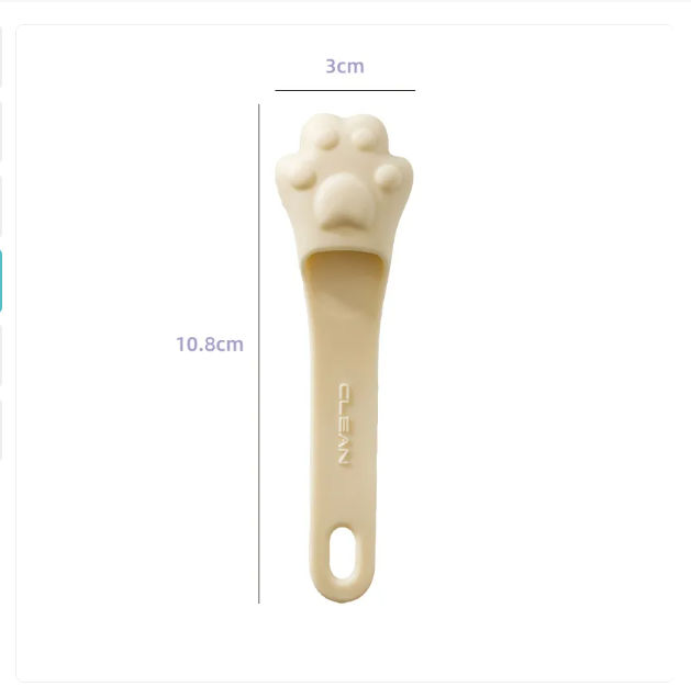 Ergonomic paw-shaped dog tongue cleaner, vital pet grooming and oral health tool