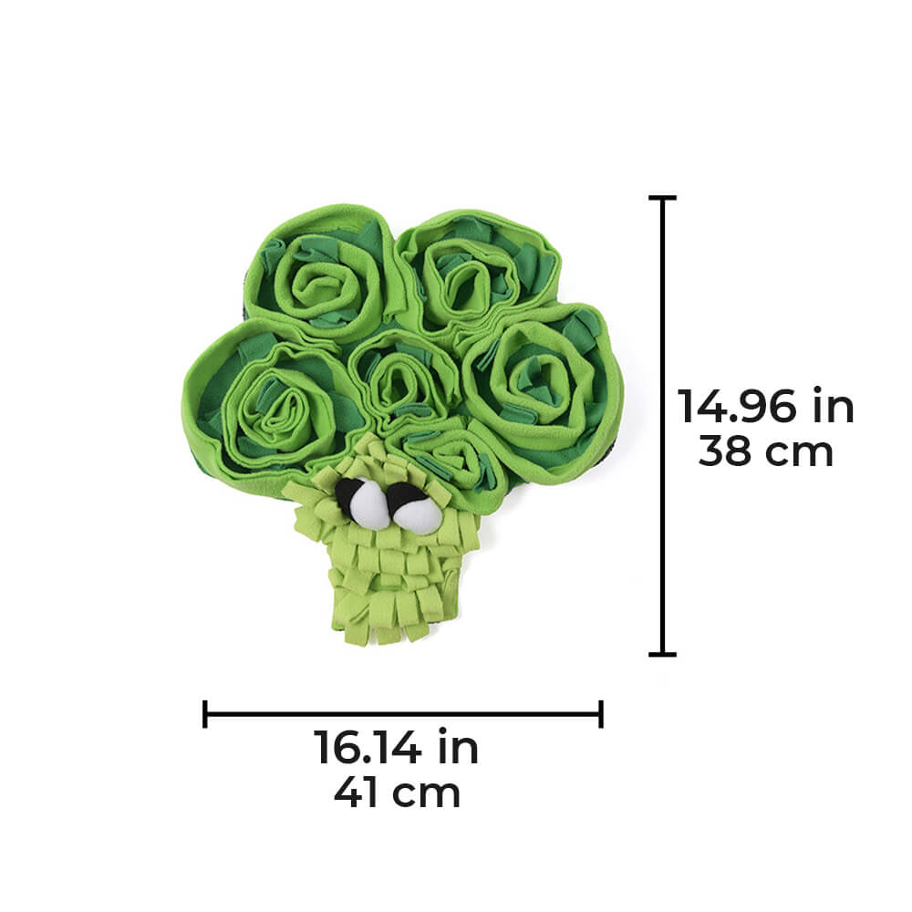Dog pawing at the interactive vegetable snuffle mat for hidden kibble