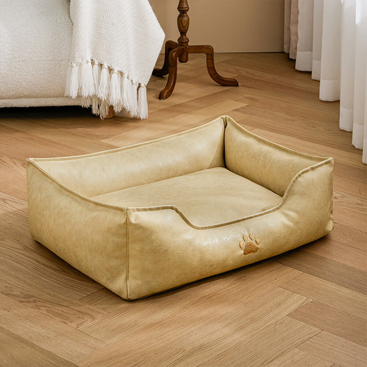 Waterproof pet bed, faux leather dog sofa with bolster and washable cover for comfort