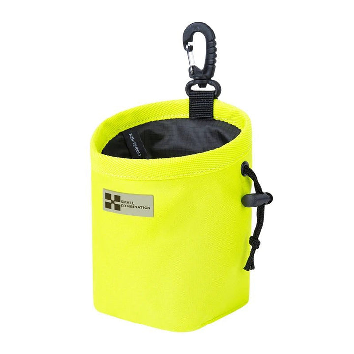 Compact dog treat pouch featuring a quick-access drawstring, perfect for on-the-go dog training.