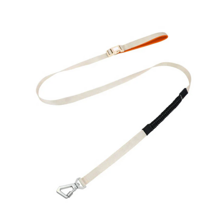Detail of the breathable mesh of a dog no-pull harness, with an attached adjustable leash.