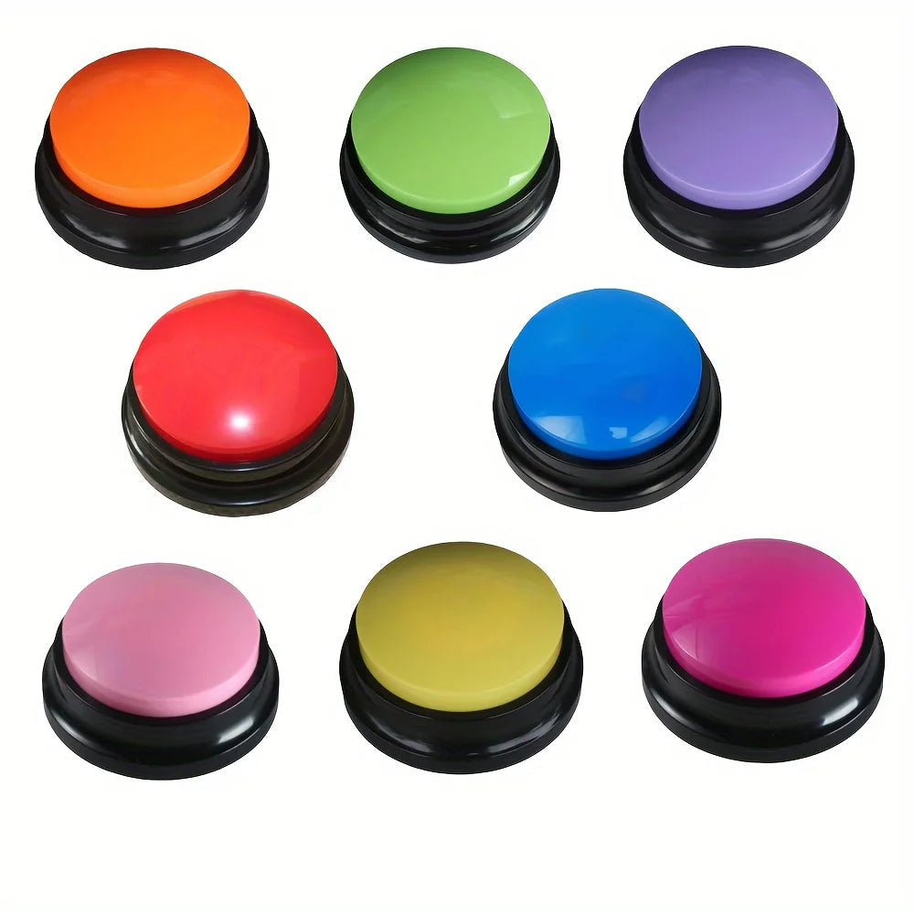 Dog pawing at a talking button, learning to communicate needs through interactive pet training.