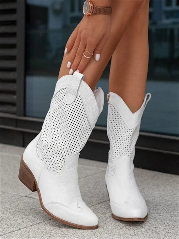 Versatile women's western ankle boots with side-zip, block heel, & perforated panels for a casual yet chic style.