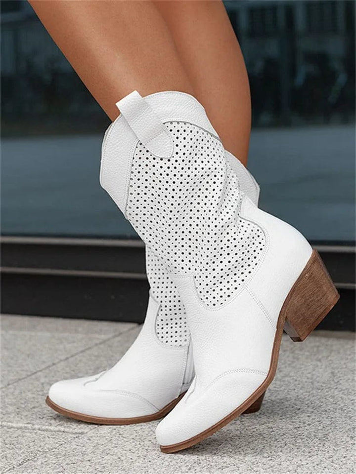 Chic women's fashion western boots featuring a sturdy block heel, side zip, & elegant perforated design.