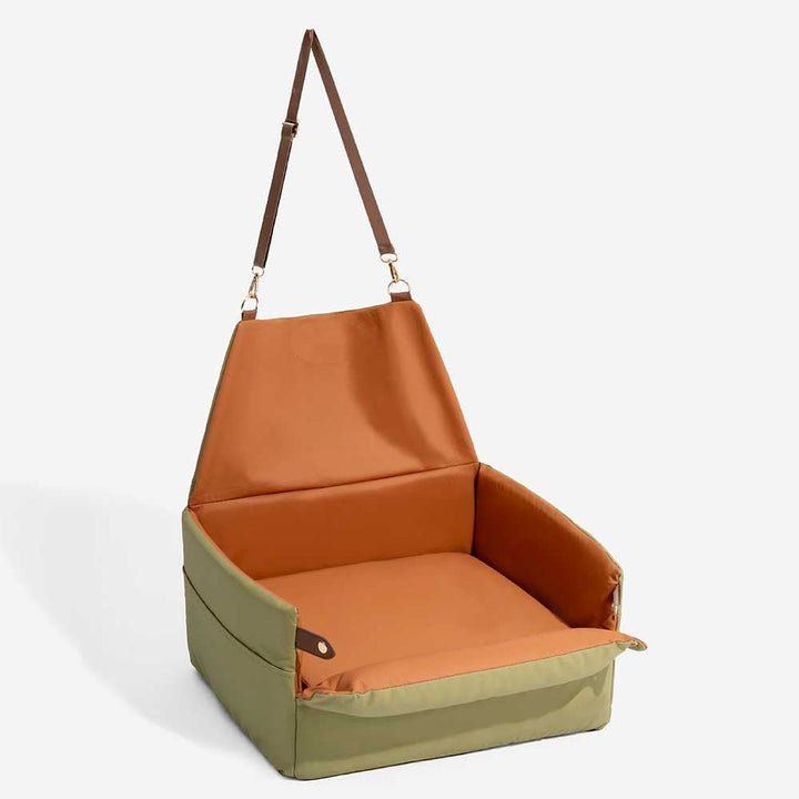 Portable elevated faux leather pet booster seat, perfect for small dogs to see out and travel safely in cars.