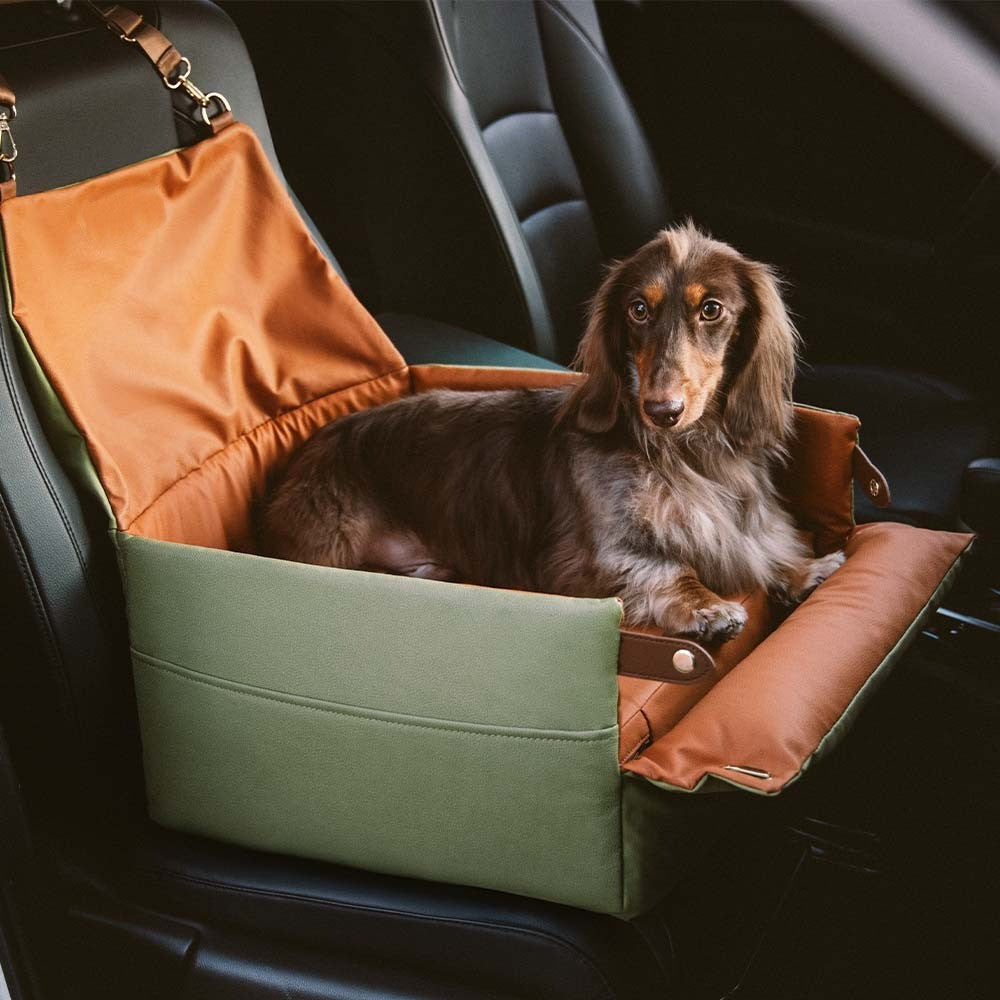 Faux leather elevated dog car booster seat for small dogs, ensuring pet safety & comfort during travel.