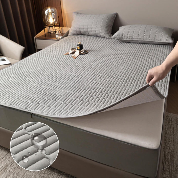 Soft waterproof mattress protector with zippered full enclosure, guarding against spills & allergens for hygienic sleep.