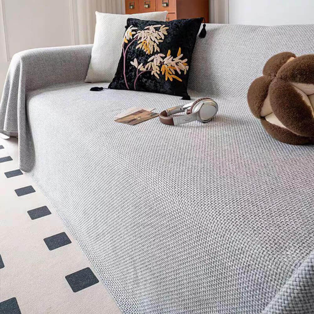 Stylish linen-look pet-friendly sofa cover. Durable, scratch-resistant couch throw for living room decor.