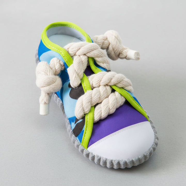 Purple dog slipper chew toy, tough & interactive. Ideal for teething puppies & playtime.