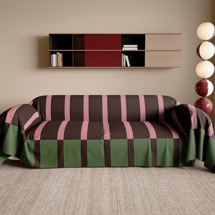 Vibrant modern striped sofa cover, a stylish & pet-friendly couch protector for dynamic living room decor.