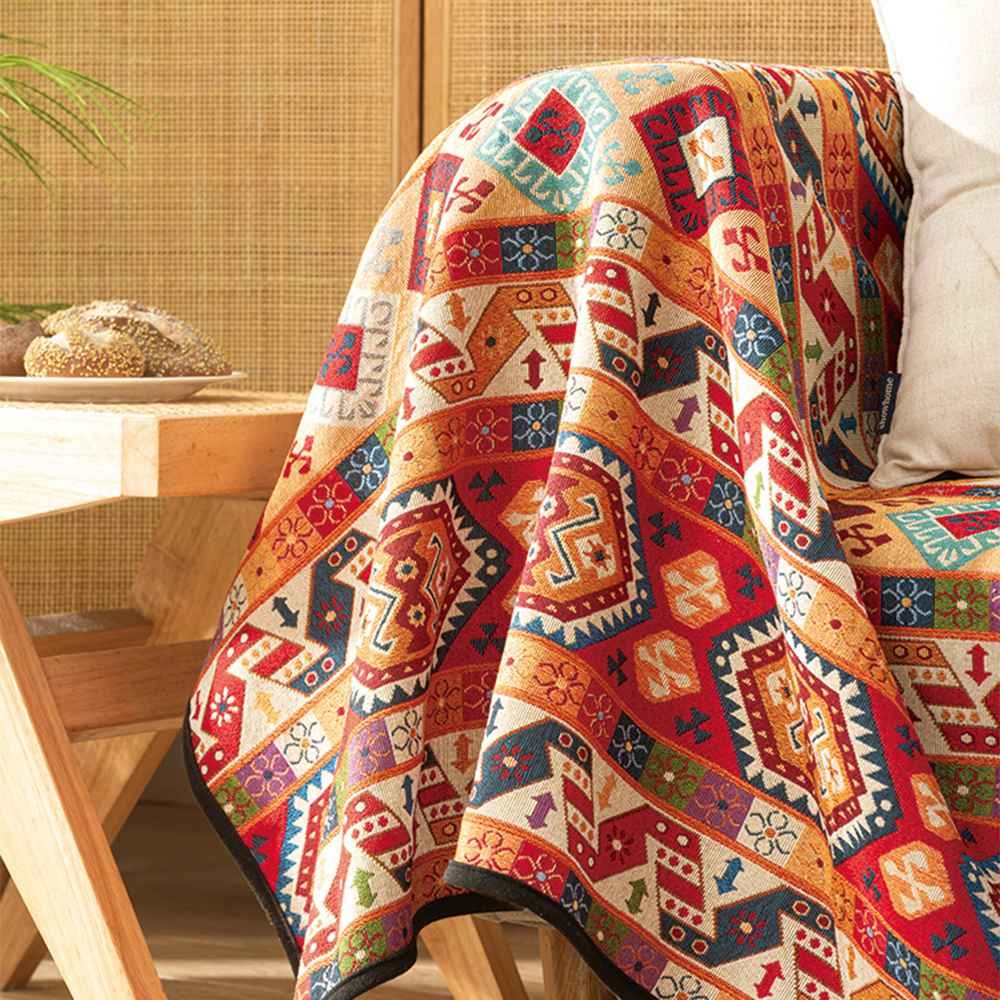 Woven jacquard accent blanket with ethnic Moroccan design. Bohemian throw for sofa, bed, and stylish home decor.