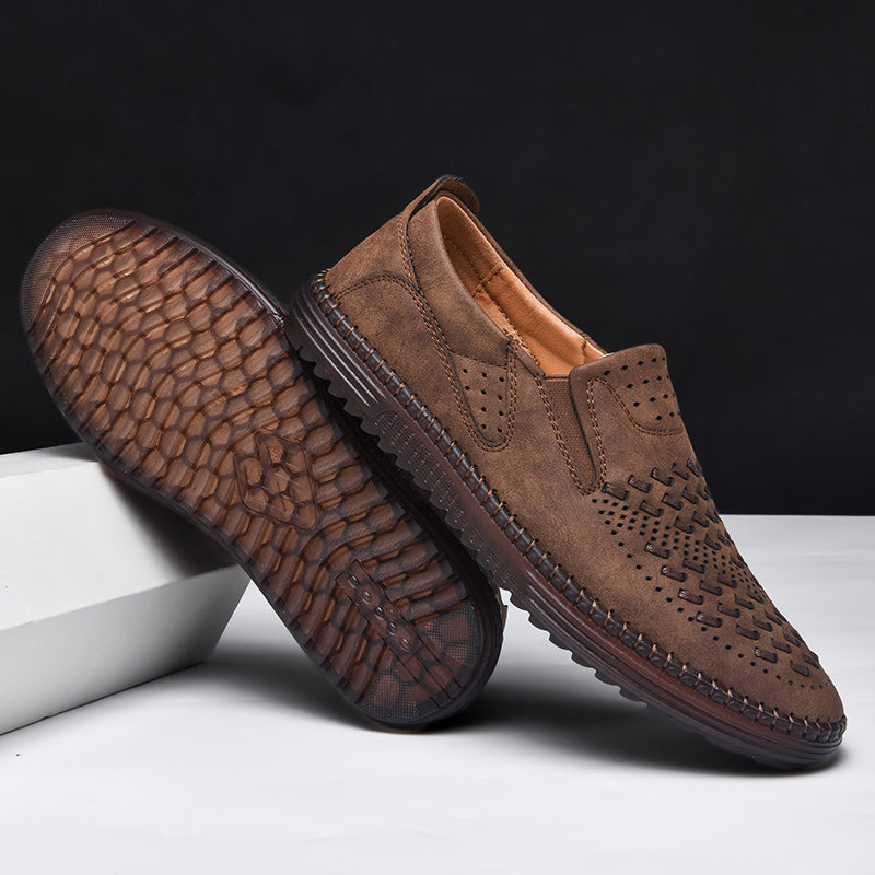 Stylish men's dress casual loafers with intricate hand-stitched details, modern fashion.