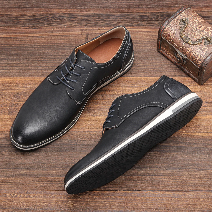 Side view of men's elegant black leather Derby dress shoes, showcasing classic design and professional style.