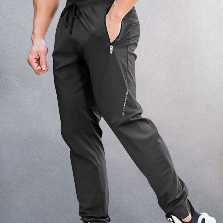 Elastische Herren Sporthose, atmungsaktiv mit Reißverschluss, ideal für Sport und Alltag, in modernem Design.
