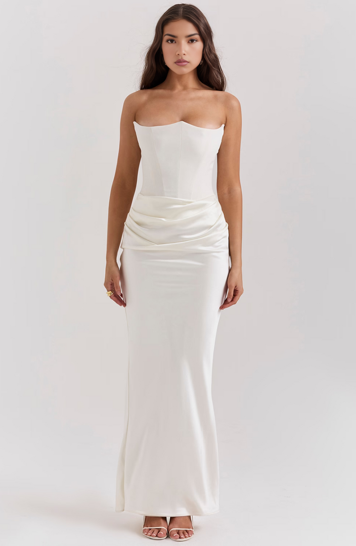 Wedding guest maxi dress, strapless and elegant with a structured corset top.