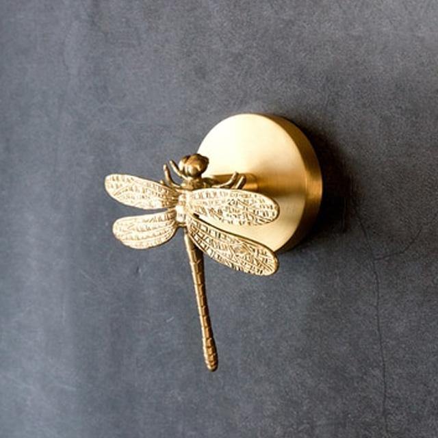 Modern gold animal wall hooks, offering unique home decor and entryway organizing.