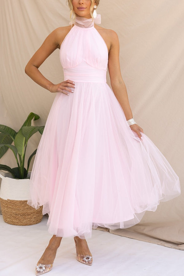 Perfect wedding guest attire: elegant halter maxi dress, a chic long formal gown for sophisticated women.