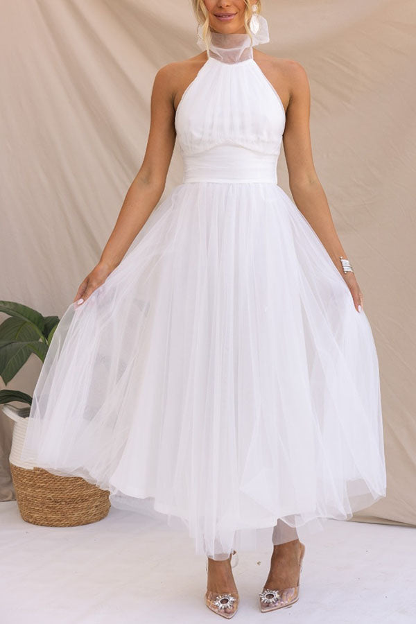 Stunning elegant halter maxi dress, ideal for evening wear, formal occasions, and wedding guest attire.