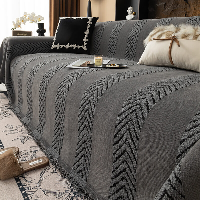 Elegant chenille throw with a herringbone texture, transforming a plain sofa into a focal point.