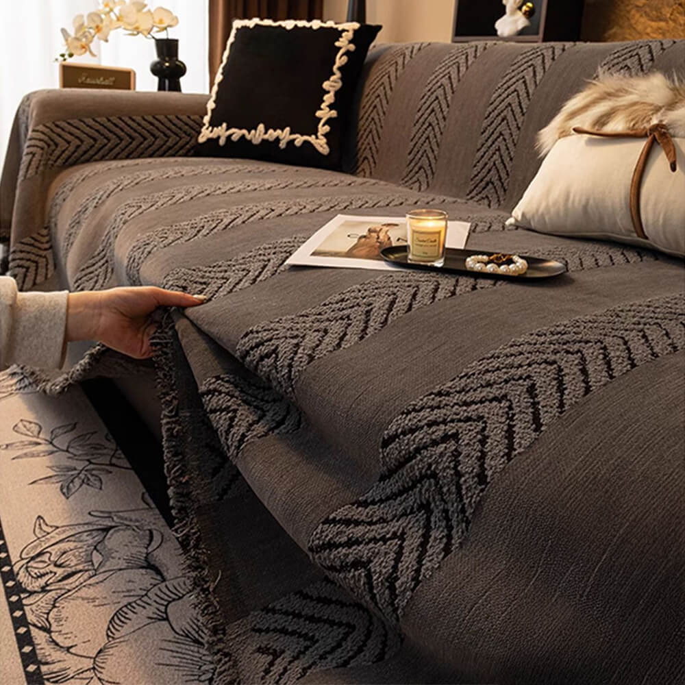 Soft-touch chenille sofa cover with an intricate herringbone pattern, machine washable for convenience.