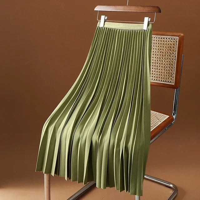 Pleated high waist midi skirt, elegant women's fashion. Versatile for office or casual looks.