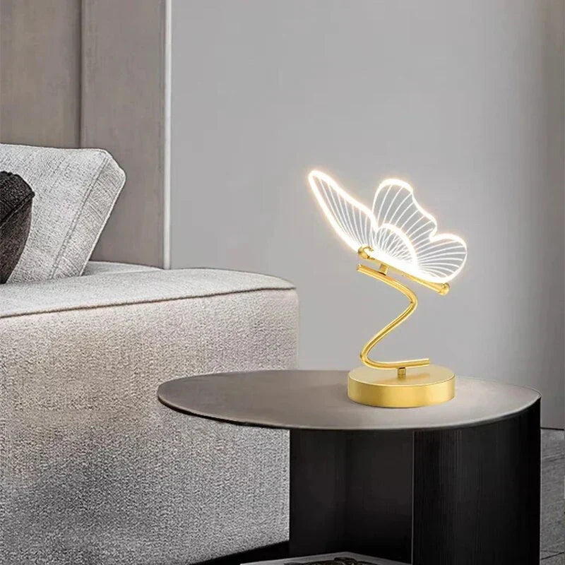Decorative butterfly LED desk lamp providing warm ambient light. Stylish home accent for any modern room.