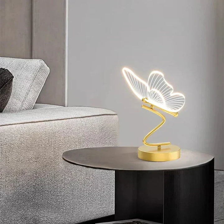 Decorative butterfly LED desk lamp providing warm ambient light. Stylish home accent for any modern room.