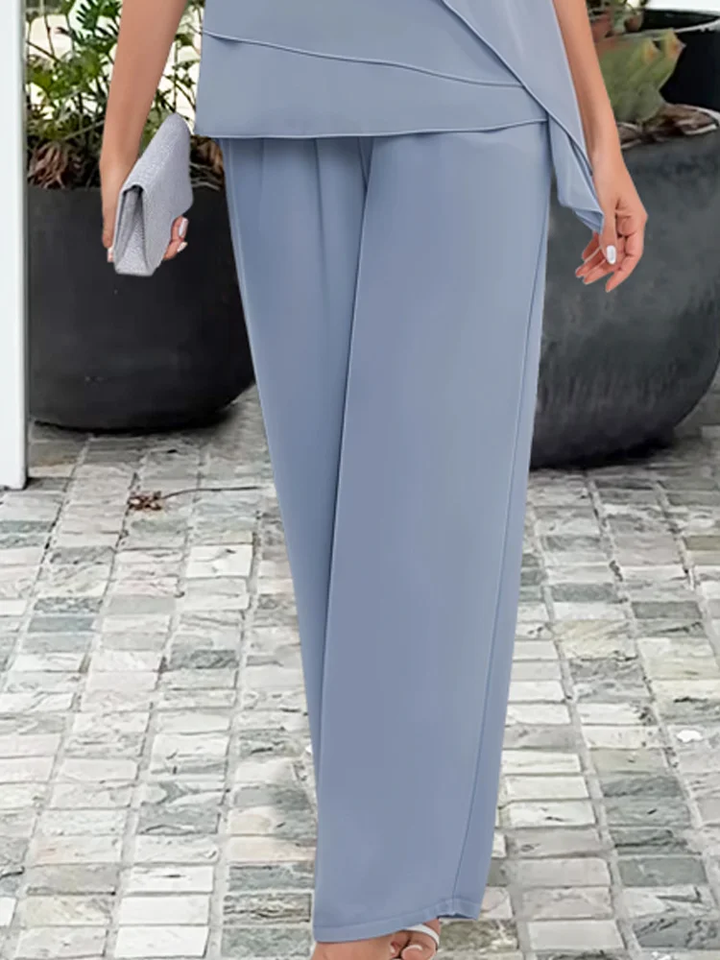 Women's elegant 2-piece pant set: asymmetrical top & wide-leg pants. Chic ensemble for cocktail or special events.
