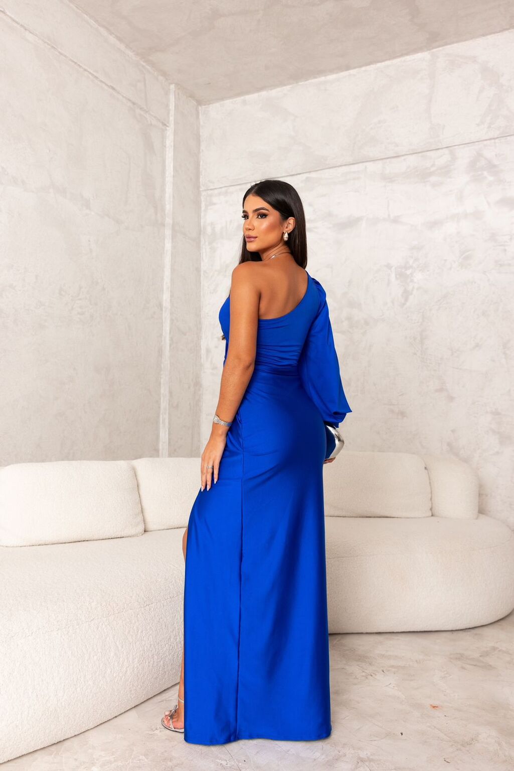 Women's formal wear: one-shoulder ruched maxi dress with a sophisticated split.