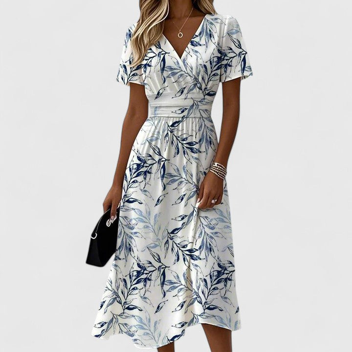 Comfortable A-line floral midi dress for women with flutter sleeves & V-neck, ideal for elegant summer or party occasions.