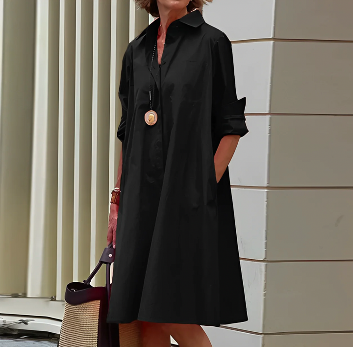 Comfortable white flowy button midi dress for women, offering elegant day to night versatility.