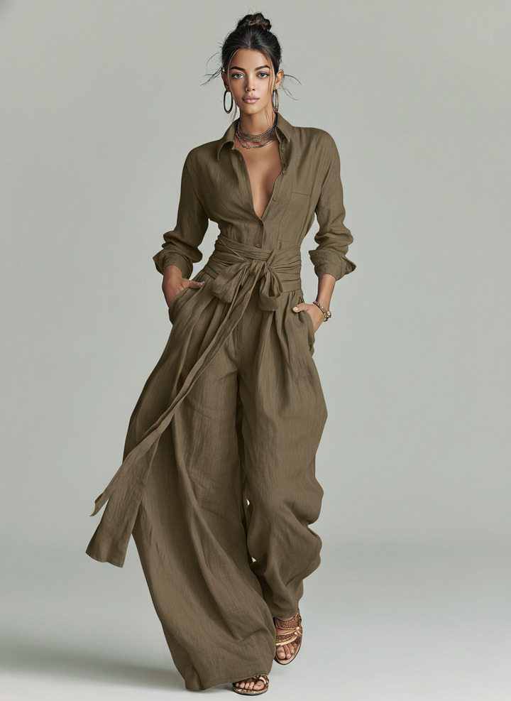 Relaxed fit women's elegant long sleeve wide leg jumpsuit with tie-waist, ideal for summer resort wear.
