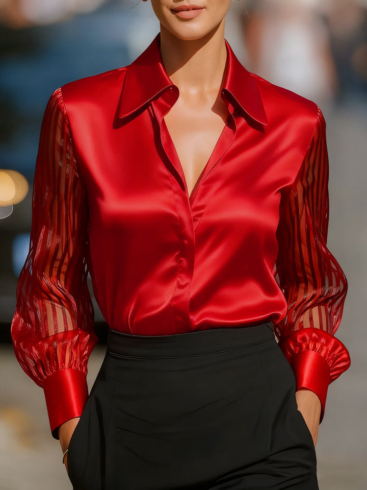 Chic women's button-up collared blouse with elegant sheer stripe long sleeves. A refined professional top.