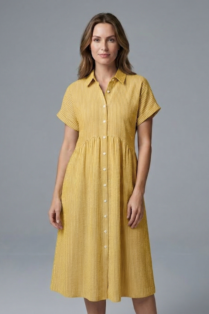Women's collared button-front midi dress on a model, styled for a professional, versatile workwear look.