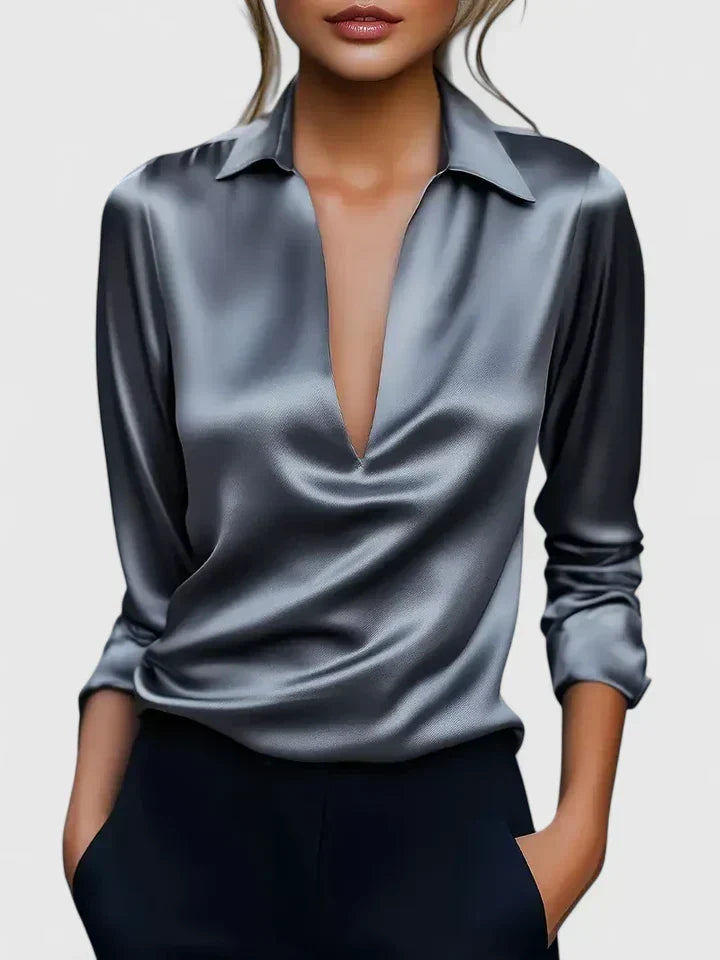 Sophisticated draped v-neck blouse for women. Long sleeve, relaxed fit, ideal for elegant evening wear.