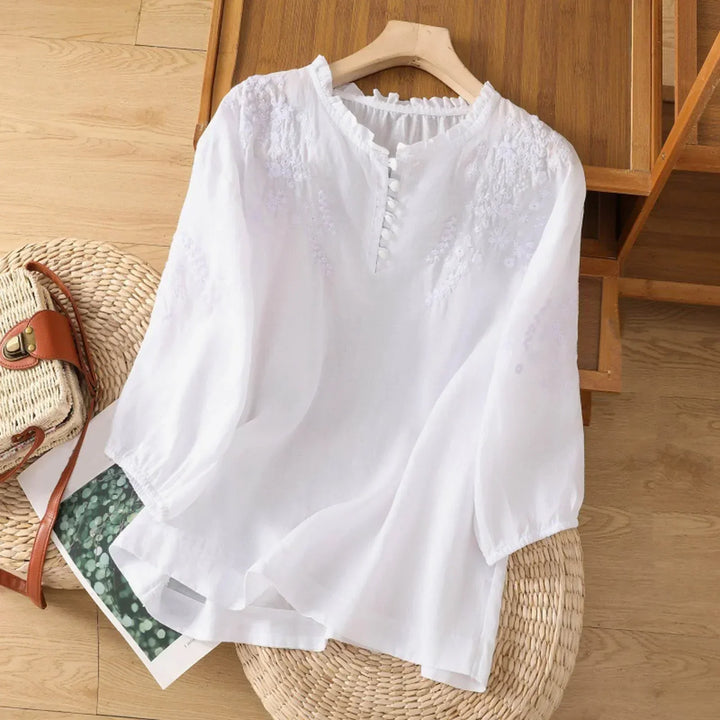 Stylish women's long sleeve floral blouse. This elegant button-front top is perfect for versatile fashion.