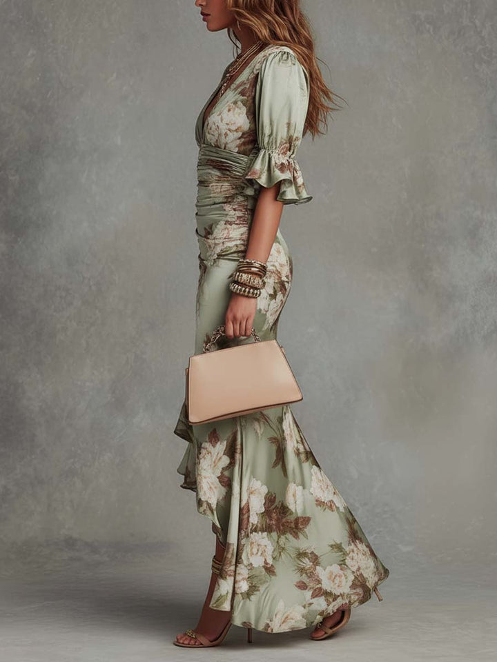 Floral V-neck maxi dress with ruched waist & fishtail hem. Ideal elegant wedding guest or formal occasion dress.