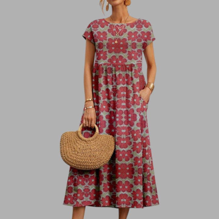 Graceful women's midi dress with a beautiful floral print. Chic and comfortable for summer events.